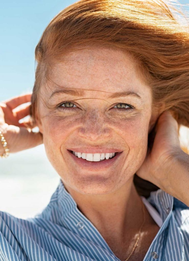 Beautiful ginger woman smiling | General Health & Wellness